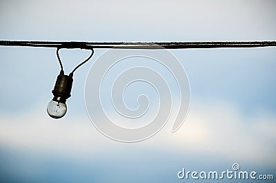String wired of bulb on blue sky background Stock Photo
