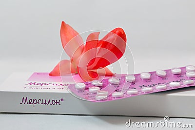 Strip and box of Organon Mercilon contraceptive pills closeup. Editorial Stock Photo