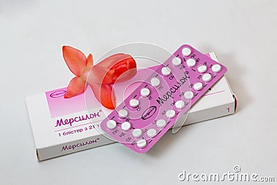 Strip and box of Organon Mercilon contraceptive pills closeup. Editorial Stock Photo