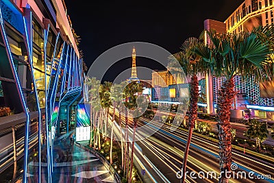 Strip night illumination, palm trees and casino in Las Vegas Editorial Stock Photo