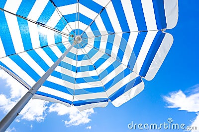 Striped beach umbrella Stock Photo