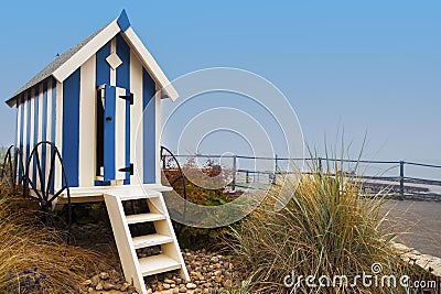 Striped blue beach hut on Filey promenade Stock Photo