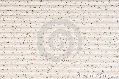 Striped embossed beige paper. Colored paper with gold dots texture background. Stock Photo