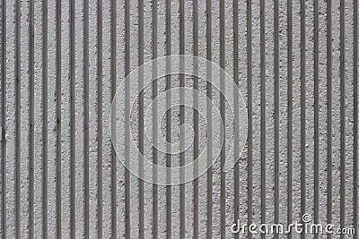 Striped gray concrete wall, with deep grooves Stock Photo