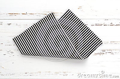 Striped kitchen cloth on white vintage wooden table. copy space Stock Photo