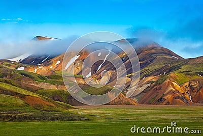 Striped mountains of rhyolite covered sunrise Stock Photo