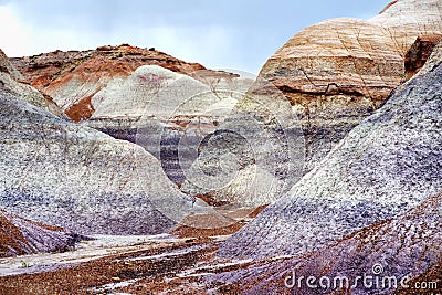 Striped purple sandstone formations of Blue Mesa badlands in Petrified Forest National Park Stock Photo