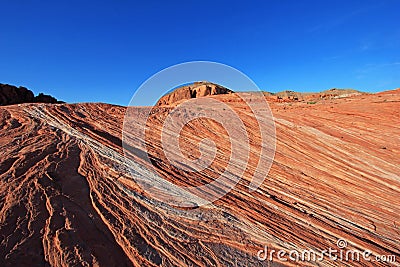 Striped Rocks on Crazy Hill in Pink Canyon, near Fire Wave at sunset, Valley of Fire State Park, USA Stock Photo