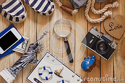 Striped slippers, camera, phone and miniature of the statue of liberty on the wooden background Stock Photo