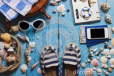 Striped slippers, phone and maritime decorations on the wooden b Stock Photo