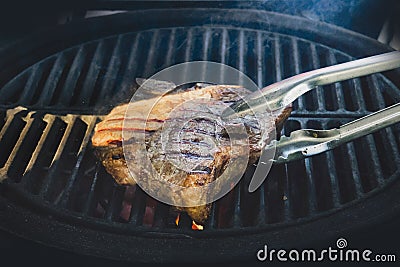 striped steak on fiery grill closeup Stock Photo