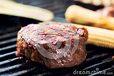 Striped steak on a grill close up Stock Photo