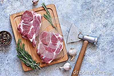 Striped steak on a wooden board with spices on a concrete plate. Ingredients for cooking Stock Photo