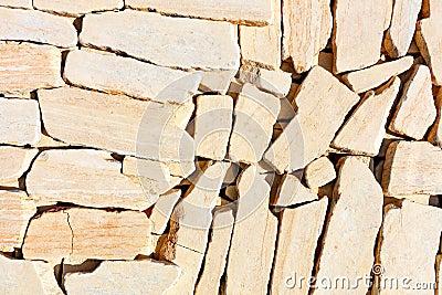 Striped texture of old yellow sandstone, pieces are matched in one plane Stock Photo