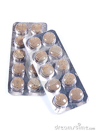 Strips of brown colored medicine tablet blisters. Stock Photo