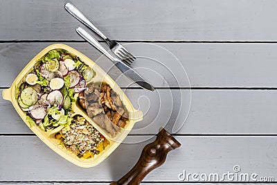 Strips of sauteed chicken and vegetables with vegetable farofa. Brazilian lunch box. Ahead meal preparation or dieting concept. t Stock Photo
