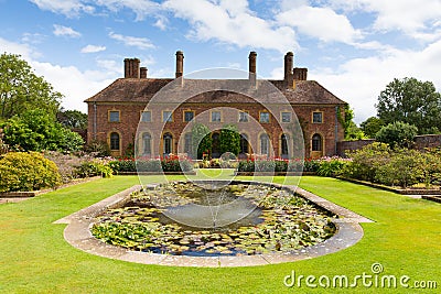 Strode House Barrington Court near Ilminster Somerset England uk with Lily pond garden in summer Editorial Stock Photo