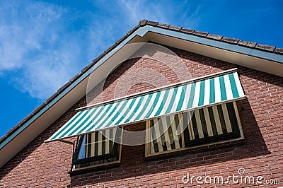 Stroe, Gelderland, The Netherlands, Roof construction with sun sheds against blue sky Editorial Stock Photo