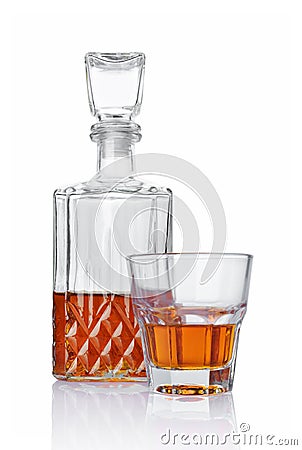 Strong alcoholic drink cognac in old fashion glass and crystal decanter Stock Photo