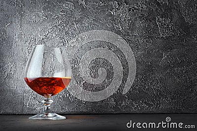 Strong alcoholic drink cognac in sniffer glass with copy space Stock Photo