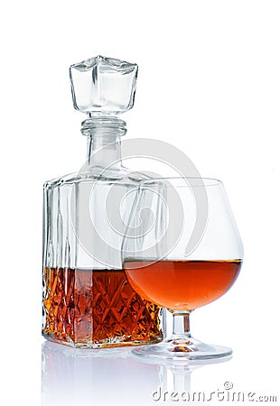Strong alcoholic drink cognac in sniffer glass and crystal decanter Stock Photo