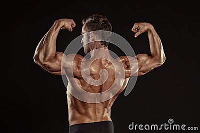 Strong Athletic Man Fitness Model posing back muscles, triceps, Stock Photo