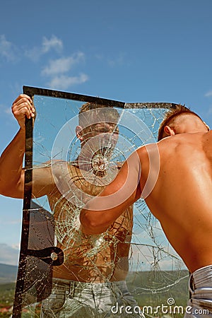 Strong and full of energy. Twins men punch a glass. Twins competitors show muscular strength and power. Practice Stock Photo