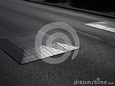 strong graphic close-up of road speed bumps Stock Photo