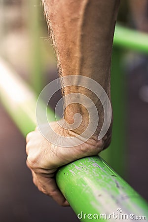 Strong Hand on the Bar Close Up Stock Photo