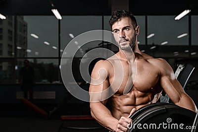 Strong and handsome athletic young man muscles abs and biceps Stock Photo