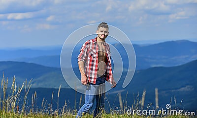 Strong hiker muscular torso. Athlete muscular guy relax mountains. Hiking concept. Power of nature. Man unbuttoned shirt Stock Photo