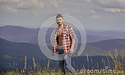 Strong hiker muscular torso. Athlete muscular guy relax mountains. Hiking concept. Power of nature. Man unbuttoned shirt Stock Photo