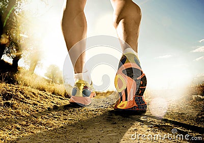 Strong legs and shoes of sport man jogging in fitness training workout on off road Stock Photo