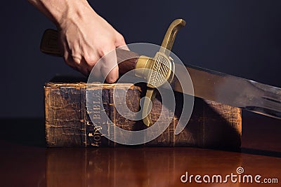 Young Athletic Man with His Bible and Sword Stock Photo