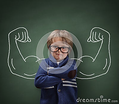 Strong man child showing bicep muscles Stock Photo