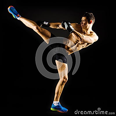 Strong man doing a high kick Stock Photo