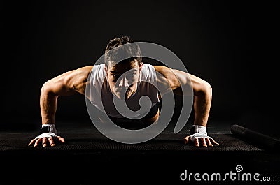 Strong man doing push-ups Stock Photo