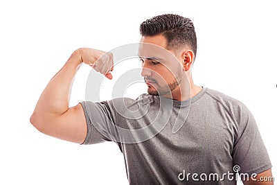 Strong Man Flexing His Arm Stock Photo - Image: 61522145