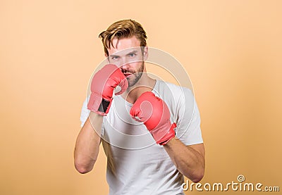 Strong muscles equal weapon. Motivated for victory. Sportsman boxer with gloves. Boxing concept. Man athlete boxer Stock Photo