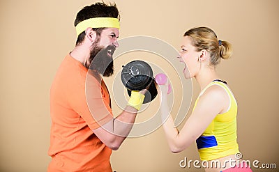 Strong muscles and power. Sporty couple training in gym. Athletic fitness competition. Weight lifting. Sport dumbbell Stock Photo