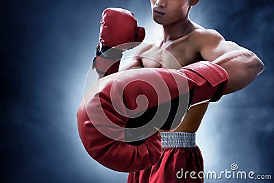 Strong muscular boxer on smoke background Stock Photo