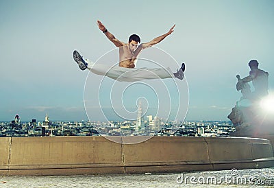 Strong muscular guy doing the splits Stock Photo