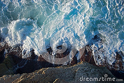 Strong sea waves hitting the stones Stock Photo