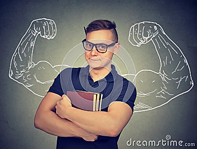 Strong nerd man with books Stock Photo