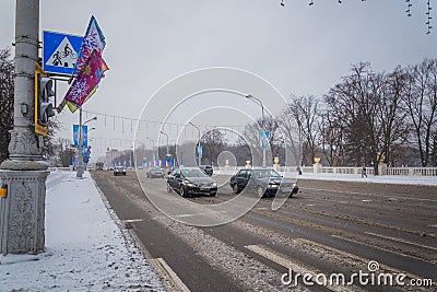 Strong snowfall, cyclone in city streets in winter Cars are cove Editorial Stock Photo