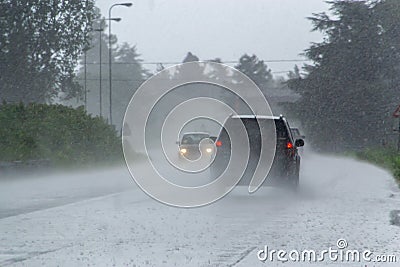 The strong storm with heavy rain on the road with poor visibility of cars Stock Photo