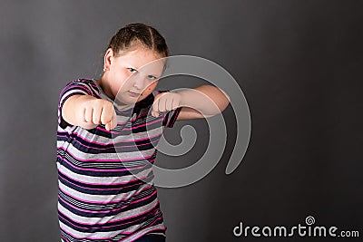 Strong stout girl in an attacking boxing rack Stock Photo