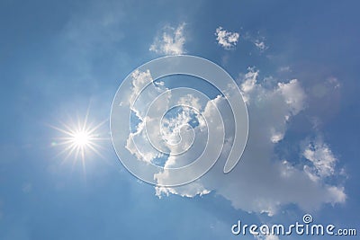 Strong sun and sky. Blue sky with clouds and sun. The sun shines bright in the daytime in summer. Blue sky with clouds and sun ref Stock Photo