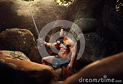 Strong warrior at the woods Stock Photo