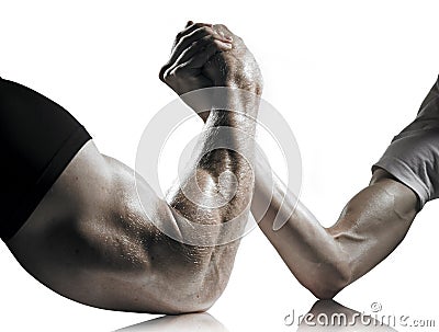 Strong and Weak Men Arm Wrestling Stock Photo